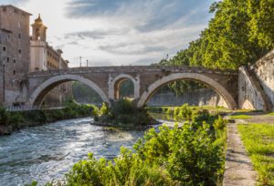 a small ancient bridge in Italy, tourist attraction