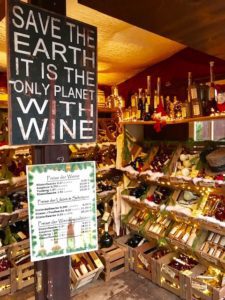 A wine shop with a board having quote on it